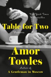The image is a book cover featuring a black and white photograph of two individuals seated at a table, focusing on their hands and partially obscured faces. The table has a white cup and saucer, and another cup held by a hand. The individuals are dressed in formal attire, suggesting a setting of elegance and sophistication. The photo contrasts with bright yellow text that overlays the image. The overall design is balanced, with the text carefully placed around the image to maintain prominence and readability.